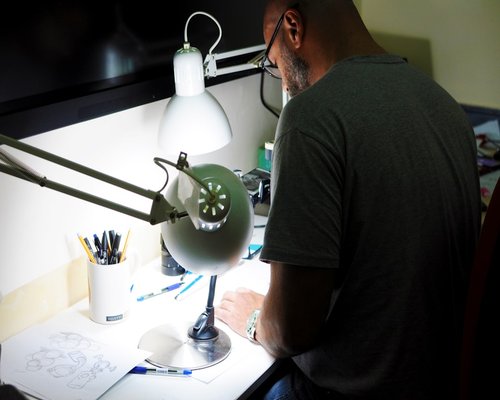 Person studying with a proper desk lamp setup
